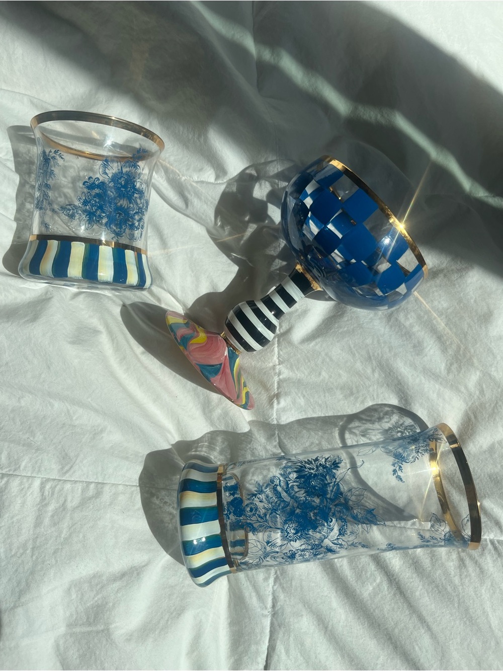 MacKenzie-Childs Blue White and Gold Glassware Set with Striped Stem Goblet